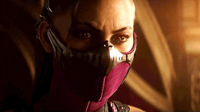 a close up of a woman 's face with a purple mask on
