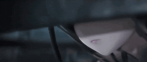 a close up of a person 's face with a pink eye