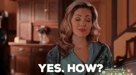 a woman is sitting in a kitchen with her eyes closed and asking yes . how ?
