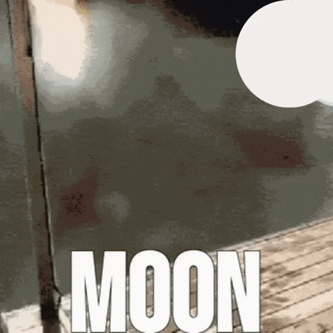 a sign that says moon on it in white