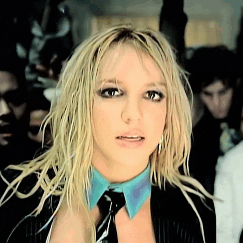 a close up of a woman wearing a blue collar and tie