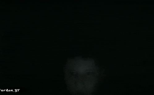 a person 's face is visible in the dark with the words " urban yj " written on the bottom