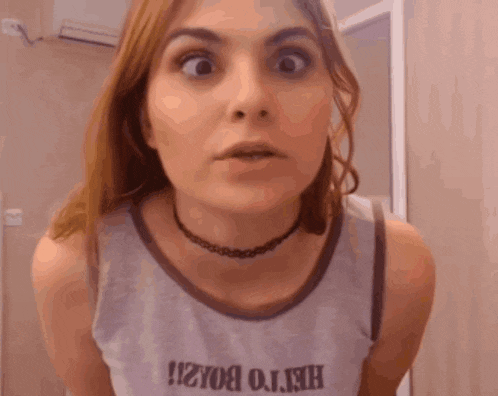 a woman wearing a choker and a t-shirt that says hello brazil