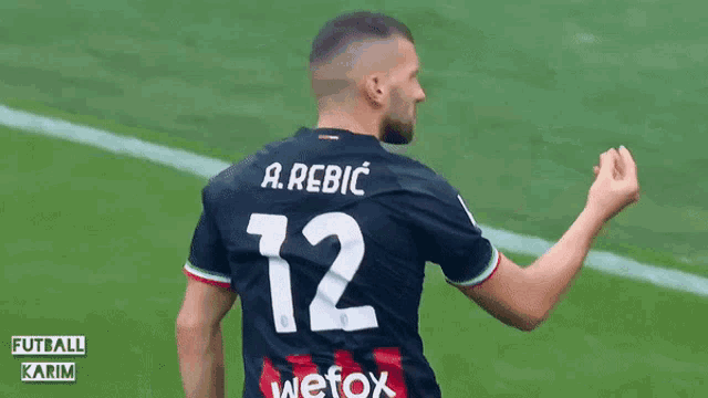 a man wearing a soccer jersey with the number 12 on it