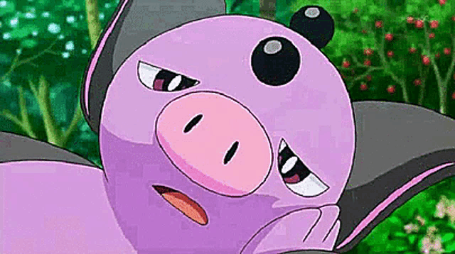 a close up of a purple and pink cartoon character with a pig 's face .