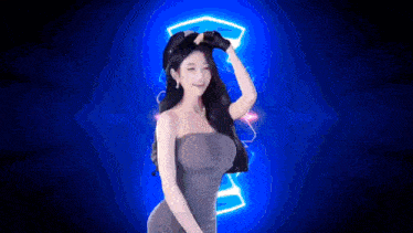 a woman in a strapless dress is dancing in front of a blue background with a neon sign .