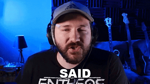 a man with a beard wearing headphones and a hat that says adidas on it