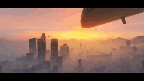 a sunset over a city with a plane flying overhead