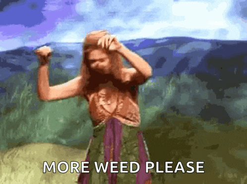 a woman in a green and purple dress is dancing in front of a mountain and says more weed please