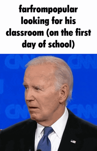 a man in a suit and tie stands in front of cnn