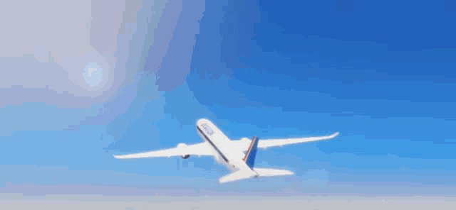 a boy and a girl are sitting next to each other on a plane and the girl is smiling .