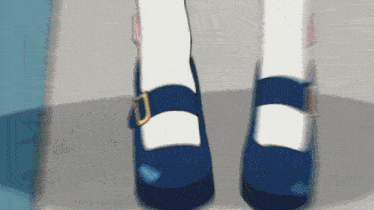 a pair of blue and white shoes on a person 's feet
