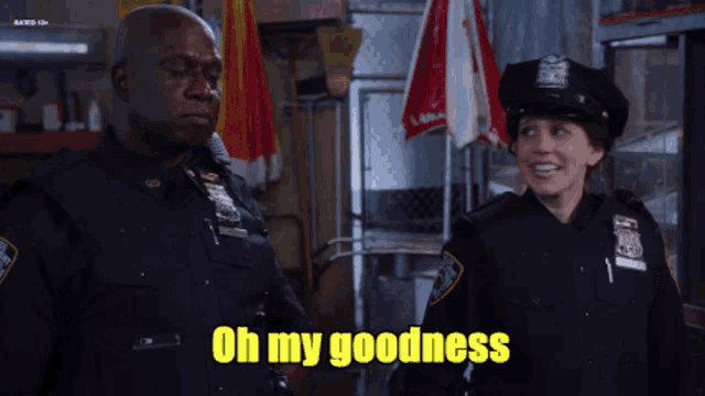 two police officers are standing next to each other with the words oh my goodness written on the bottom