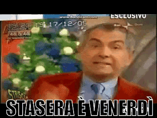a man in a red suit and tie says stasera venerdi