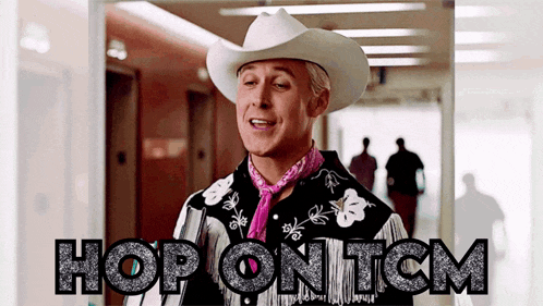 a man wearing a cowboy hat and a shirt that says hop ontcm