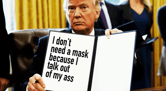 donald trump holds a sign that says i don t need a mask because i talk out of my ass