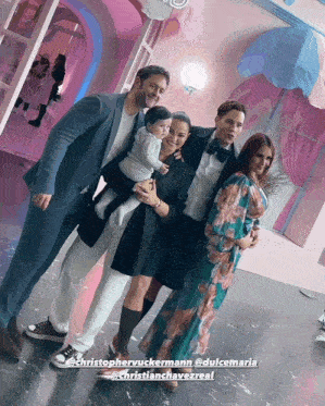 a group of people posing for a photo with the name christophervuckmann on the bottom right