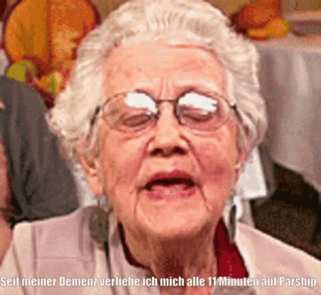 an elderly woman wearing glasses says seit meiner dement verliebe ich mich alle 11 minuten au parship