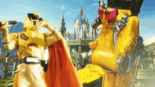 a yellow robot with a red cape is standing next to a man in a gold suit