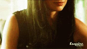 a close up of a woman 's face with esquire network written on the bottom right