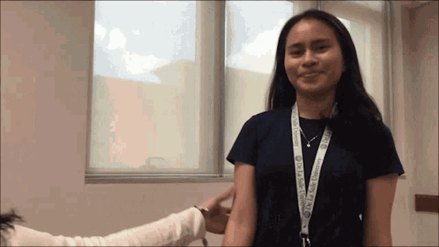 a woman wearing a lanyard that says ucsd