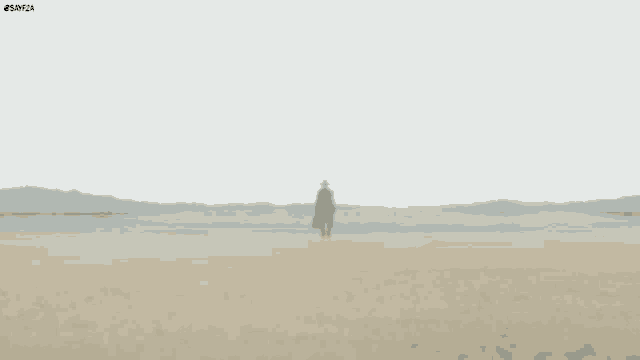a blurred image of a man walking on a beach .