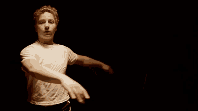 a blurry picture of a man in a white t-shirt
