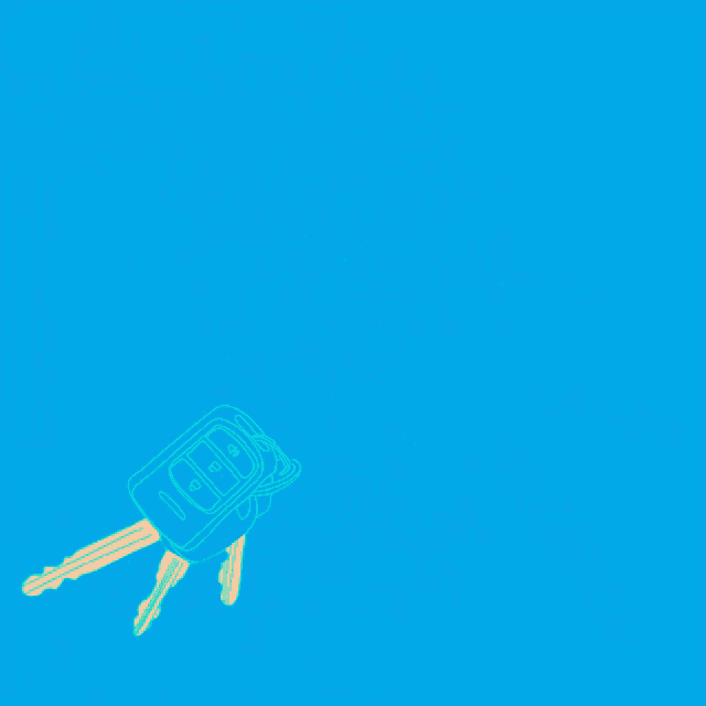 a bunch of keys are laying on a blue background with a remote control