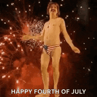 a naked man in a swim trunk is dancing in front of fireworks .