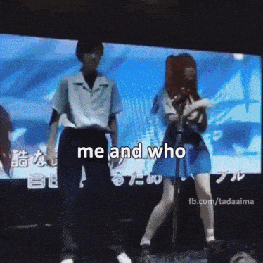a man and a woman are dancing in front of a large screen that says " me and who "