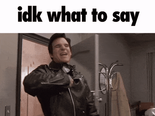 a man in a leather jacket stands in front of a door with the words idk what to say above him