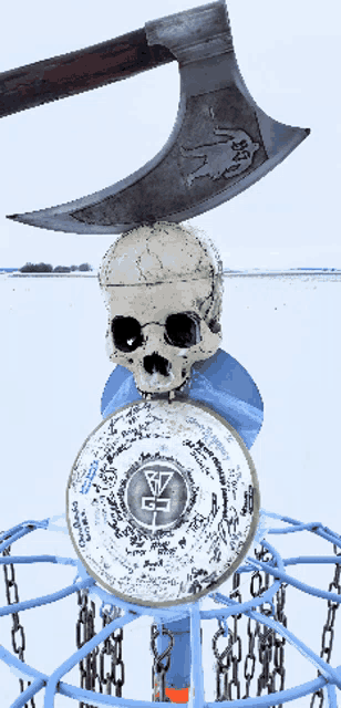 a skull and an axe on top of a frisbee