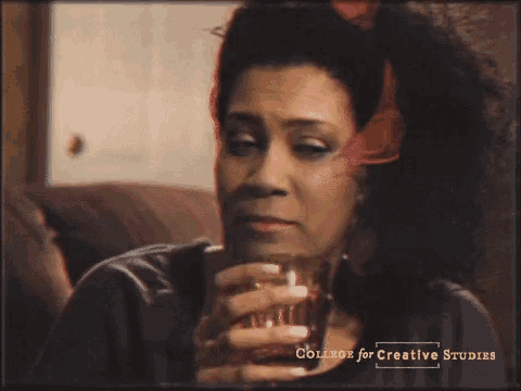 a picture of a woman drinking from a glass with the words college for creative studies on the bottom