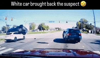 a white car brought back the suspect while driving down a street