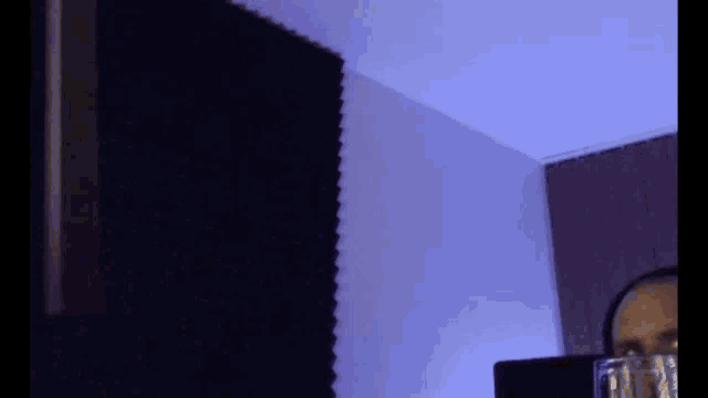 a man wearing headphones gives a thumbs up sign