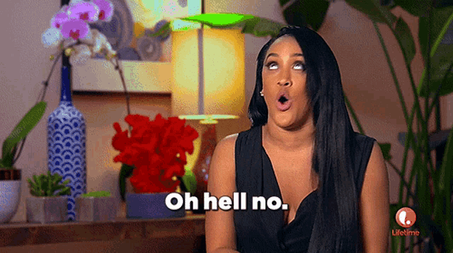 a woman says oh hell no in front of flowers