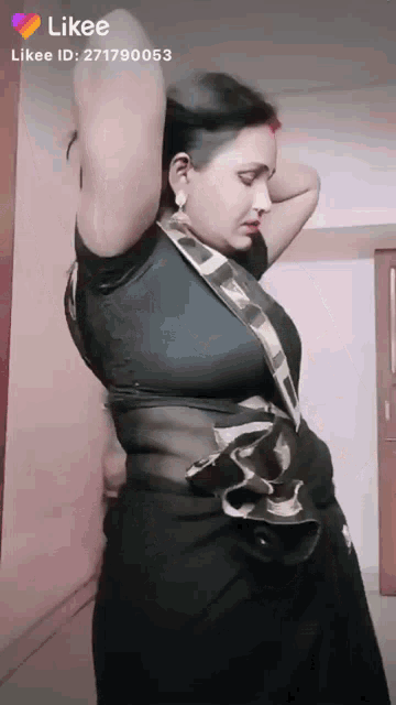 a likee video of a woman in a black blouse