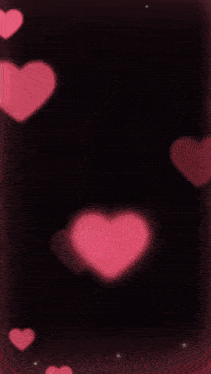 a man and a woman are surrounded by pink hearts on a black background