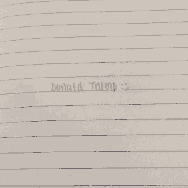 donald trump is written on a piece of white paper