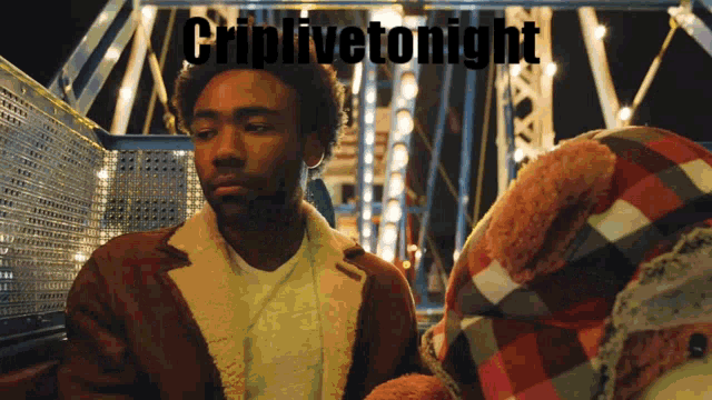 a man in a brown jacket stands in front of a sign that says cripfivetonight