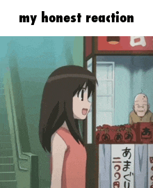 a girl in a red shirt is standing in front of a booth with chinese writing on it