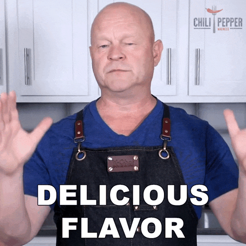 a man wearing an apron with the words delicious flavor written on it