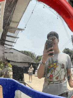 a man is taking a picture of himself in the mirror