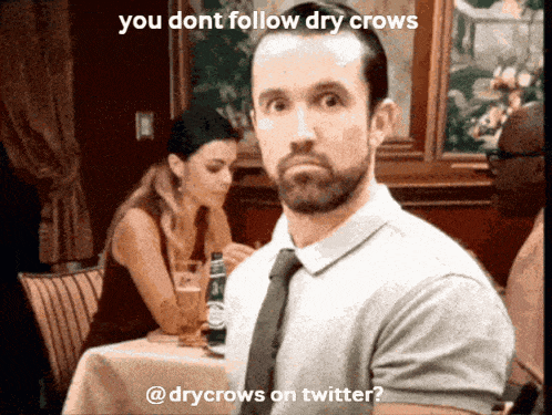 a man sitting at a table with a caption that says you dont follow dry crows @drycrows