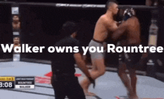 two men are fighting in a boxing ring and the words walker owns you roundtree are on the screen