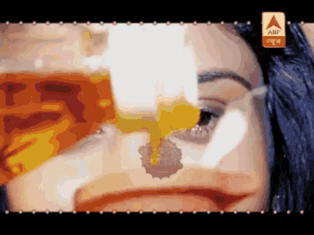 a close up of a woman 's face with an abf logo on the bottom