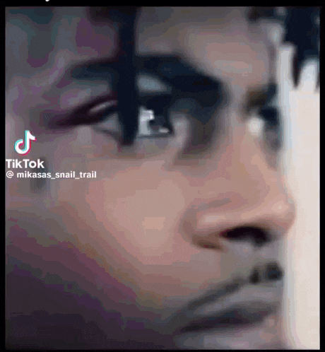 a close up of a man 's face with a tiktok watermark on it