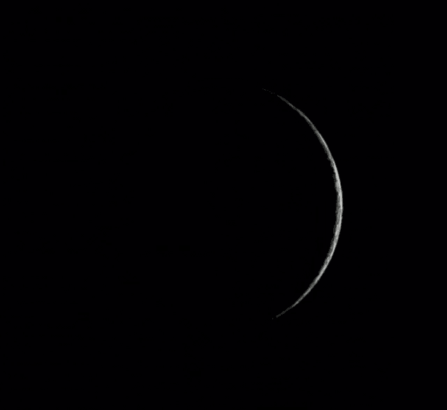 a black and white photo of the full moon