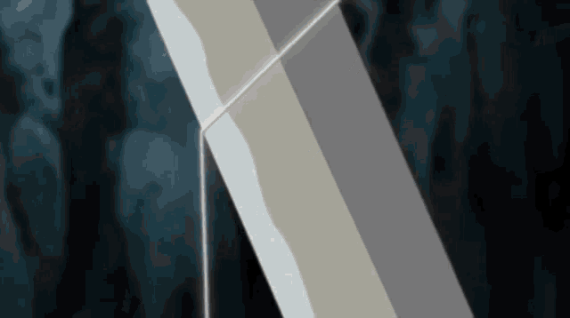 a close up of a white x on a black background