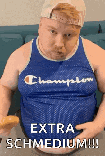 a fat man in a champion tank top is eating a donut
